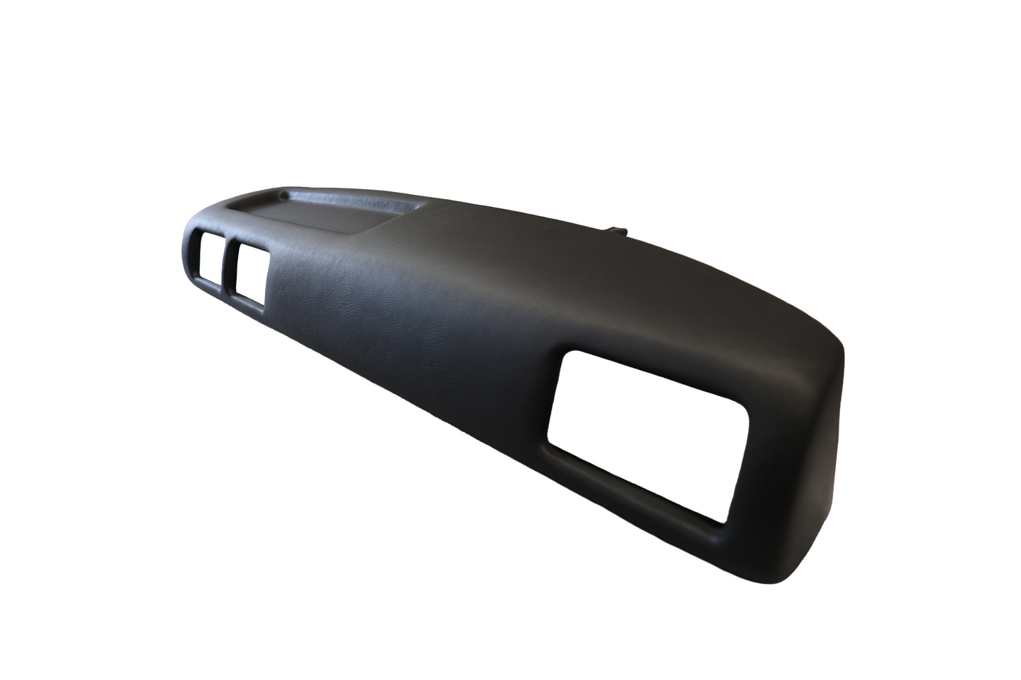 Perspective view of the black Just Dashes SoftCap padded dash cover for 1987-1988 Toyota Pickup and 4Runner, showing the side profile and molded design.