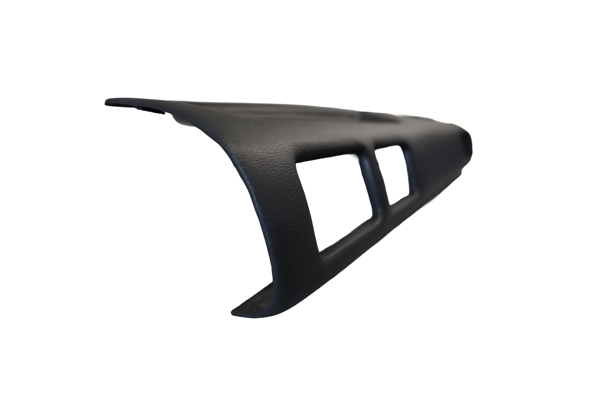 Close-up side profile of the black Just Dashes SoftCap padded dash cover for 1987-1988 Toyota Pickup and 4Runner, showing the OEM-style grain texture and vent cutouts